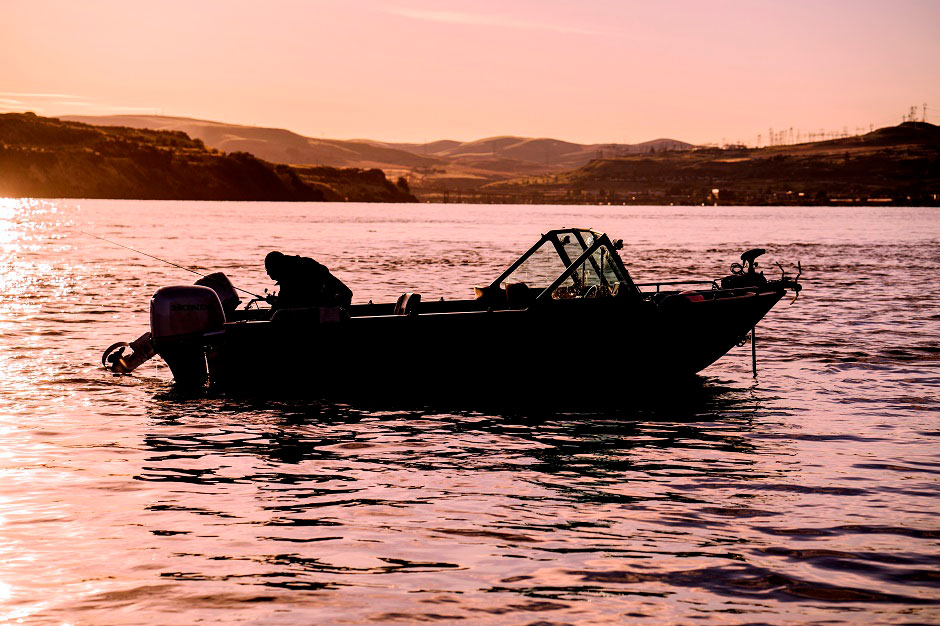 Image of Northern Pikeminnow fisherman on boat in the Columbia River.