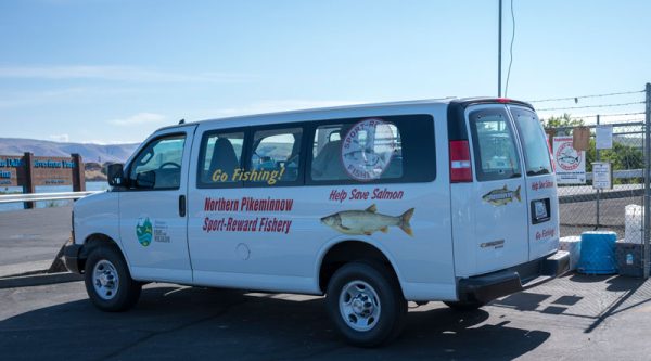 Image of Northern Pikeminnow Sport-Reward Program van at The Dalles Boat Bason.